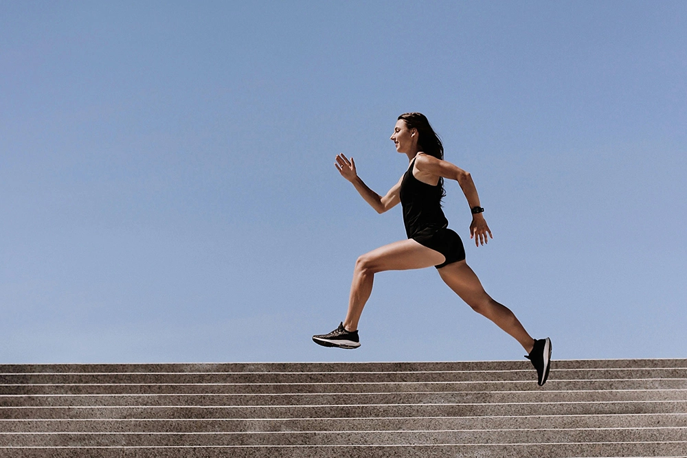Focused athlete pushing through intense sprinting